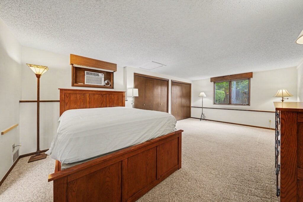 Main-floor primary bedroom with spacious layout at 2126 Genoa Court in Loveland