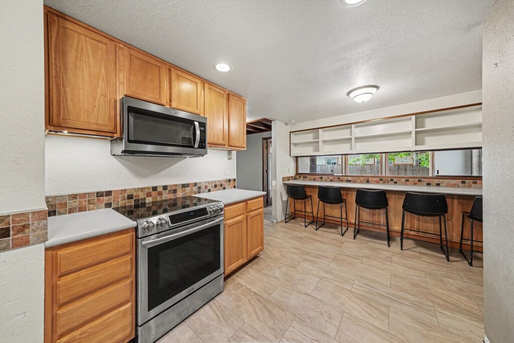 Updated kitchen with stainless steel appliances and eat-in dining area at 2126 Genoa Court