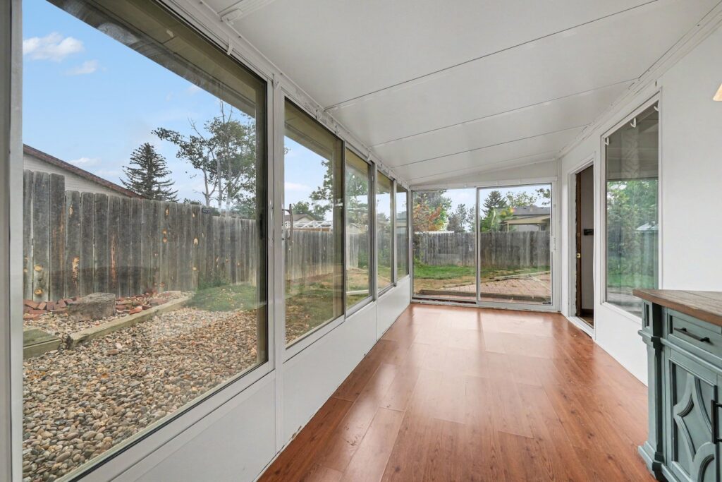 Bright sunroom overlooking the backyard at 2126 Genoa Court in west Loveland