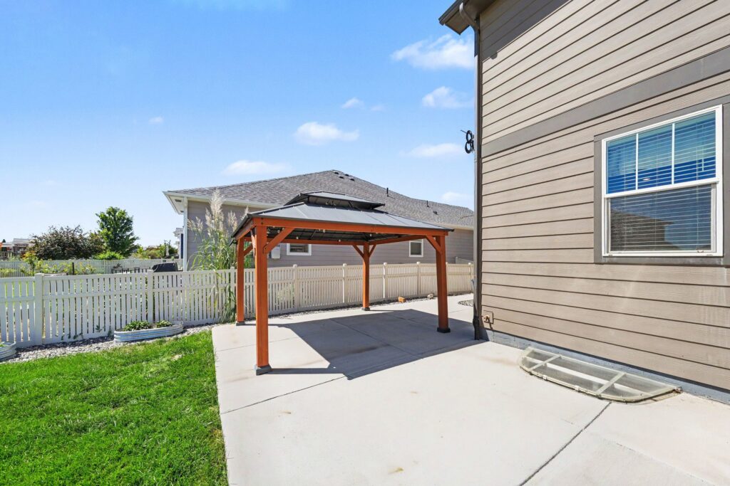 Backyard pergola and patio at 5370 Silverleaf Ave in Firestone, CO