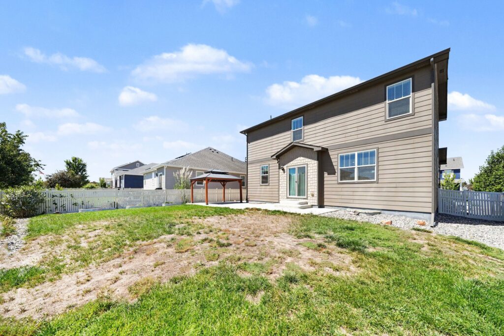 Fenced backyard with established landscaping, patio and pergola at 5370 Silverleaf Ave