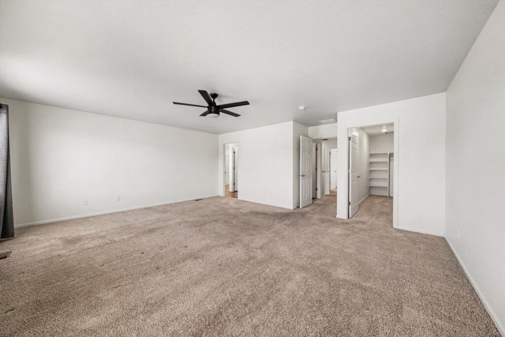 Spacious upstairs primary bedroom at 5370 Silverleaf Ave in Firestone