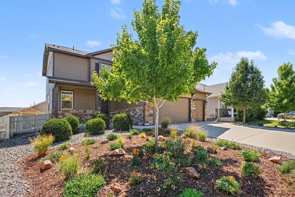 Low-water xeriscaped front yard at 5370 Silverleaf Ave in Firestone